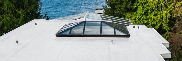 White, low slope PVC roof on home in Seattle, Washington