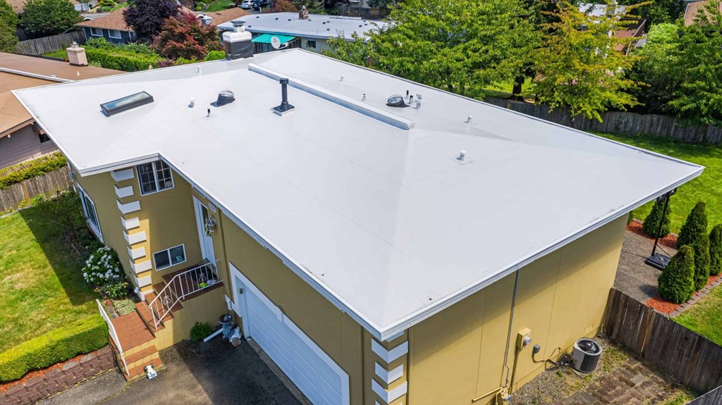 Photo of Side View of Modern Roof of House with Flat PVC Roofing, Seattle, WA - Valentine Roofing